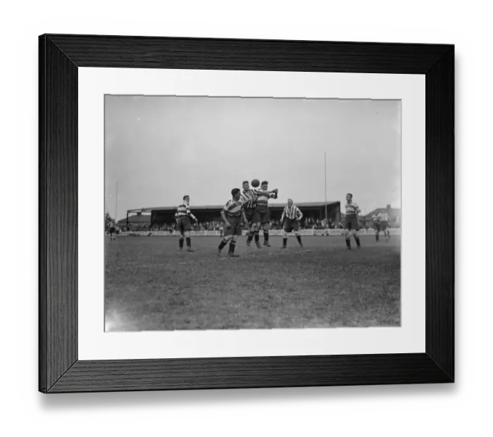 Framed Print : Footballers at Dartford. Players compete for the ball in the air Framed Print : Footballers at Dartford. Players compete for the ball in the air
