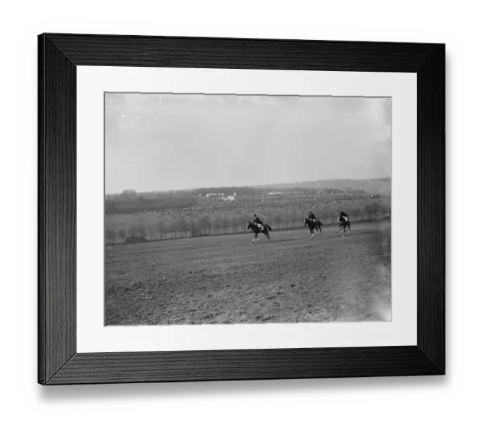 Framed Print : Riders canter across the field with the view of the R A Woolwich point to point in Framed Print : Riders canter across the field with the view of the R A Woolwich point to point in