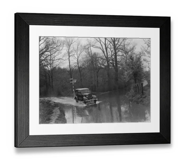 Framed Print : A car drives through the floods in Hockenden, Kent. 1937 Framed Print : A car drives through the floods in Hockenden, Kent. 1937