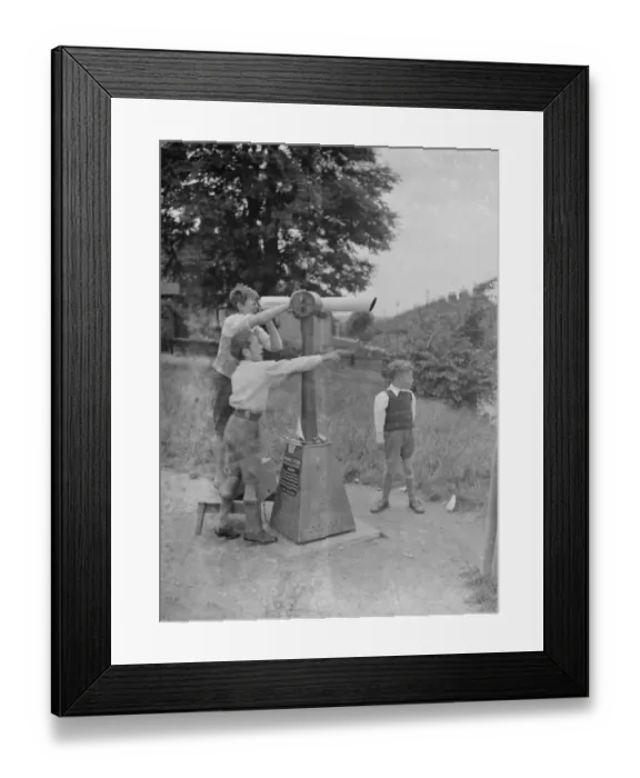 Framed Print : Children looking through telescope. 1937