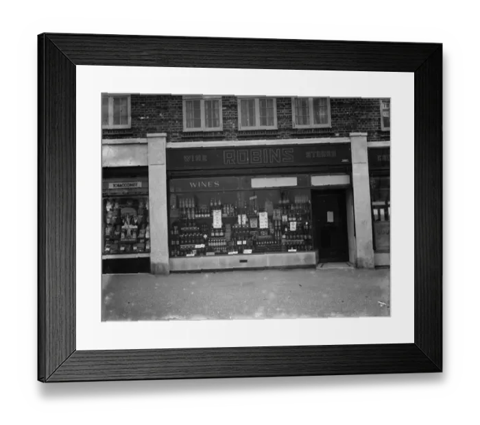 Framed Print : The shop front of Robins Off licence in Beckenham, Kent. 1 March 1936 Framed Print : The shop front of Robins Off licence in Beckenham, Kent. 1 March 1936