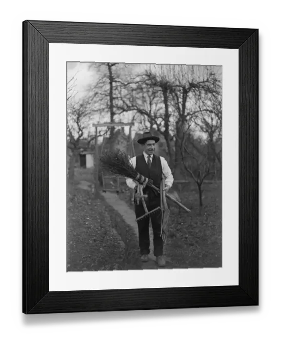 Framed Print : Man carrying garden tools, rake, spade and besom broom. 1935 Framed Print : Man carrying garden tools, rake, spade and besom broom. 1935
