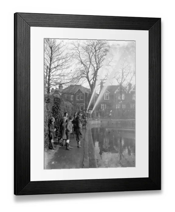 Framed Print : Children watching firemen dealing with flames in Chislehurst, Kent. 1933 Framed Print : Children watching firemen dealing with flames in Chislehurst, Kent. 1933