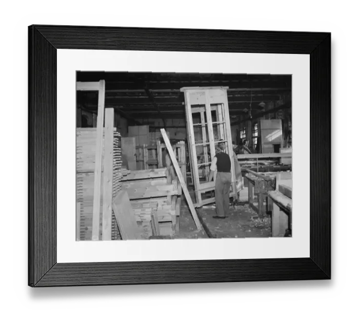 Framed Print : A pair of joiners works on a piece at the G Ellis joinery works in Hackney