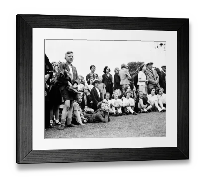 Framed Print : The crowd watching a trapeze artist performing at the Sidcup fete in Kent Framed Print : The crowd watching a trapeze artist performing at the Sidcup fete in Kent