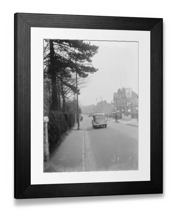 Framed Print : A street light which is shrouded by branches in Sidcup, Kent. 1937