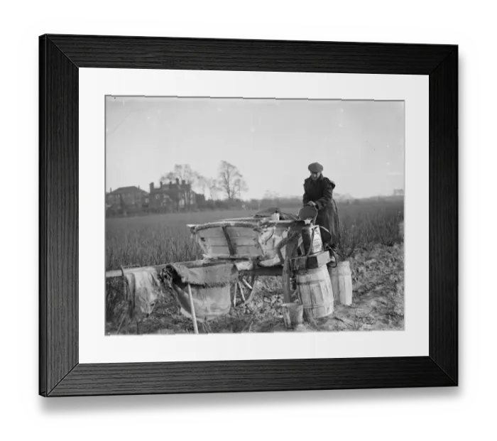 Framed Print : A farmer refills his barrels with fruit spray. 1936