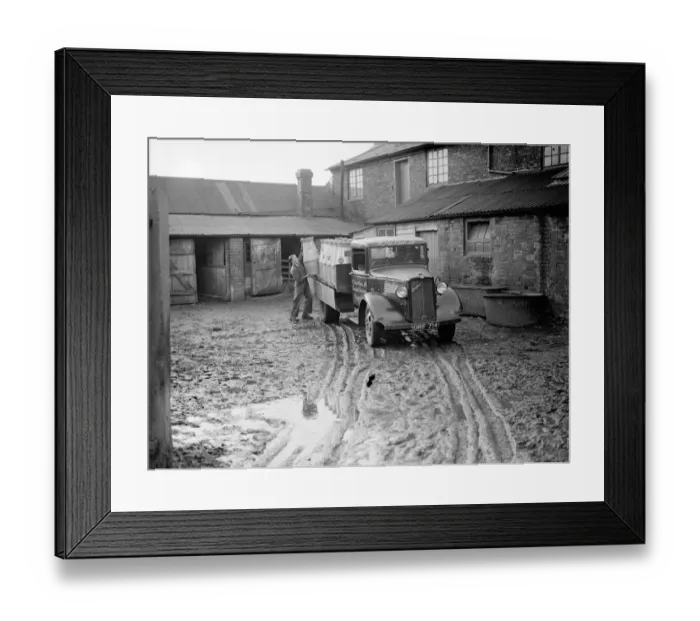Framed Print : Milk churns being loaded in a muddy farmyard onto a truck belonging to R Gee and Sons Framed Print : Milk churns being loaded in a muddy farmyard onto a truck belonging to R Gee and Sons