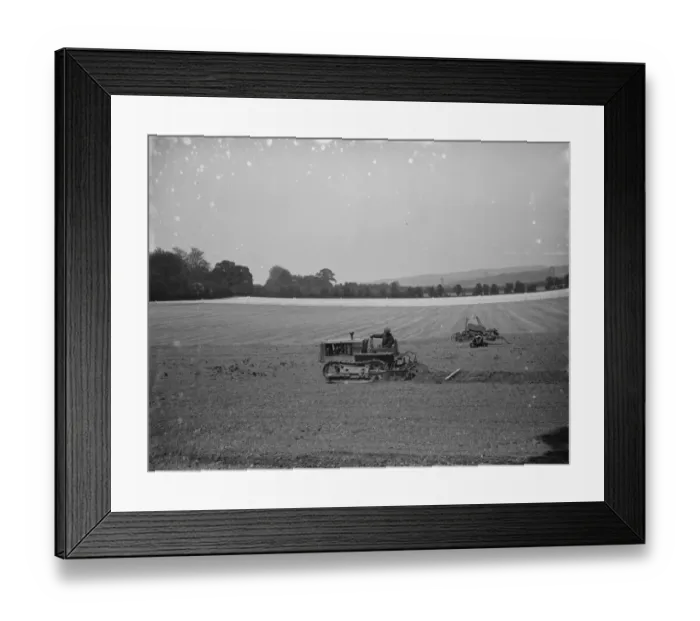 Framed Print : A farmer and his tank track tractor, harrow a field 1936 Framed Print : A farmer and his tank track tractor, harrow a field 1936