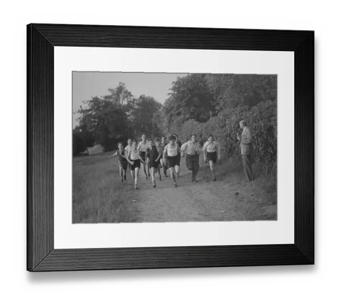 Framed Print : Jewish refugees running in the fields of Chislehurst, Kent. 1939 Framed Print : Jewish refugees running in the fields of Chislehurst, Kent. 1939