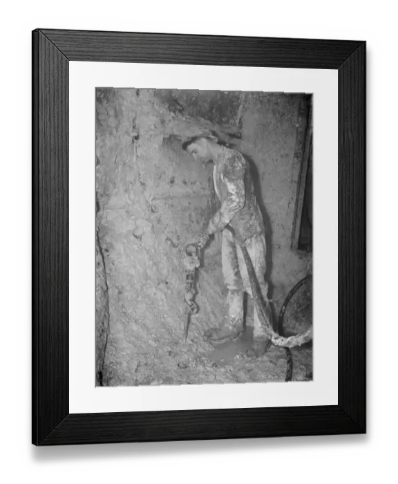 Framed Print : The completion of the pilot Dartford Tunnel. A miner works around a tunneling Framed Print : The completion of the pilot Dartford Tunnel. A miner works around a tunneling