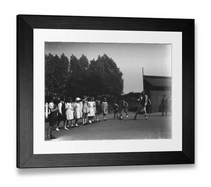 Framed Print : A woman playing stoolball with children in Hartley, Kent. 1937 Framed Print : A woman playing stoolball with children in Hartley, Kent. 1937
