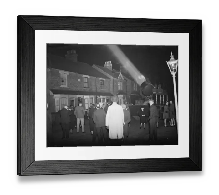 Framed Print : A crowd watching the mobile Army searchlight as it progresses down their street Framed Print : A crowd watching the mobile Army searchlight as it progresses down their street