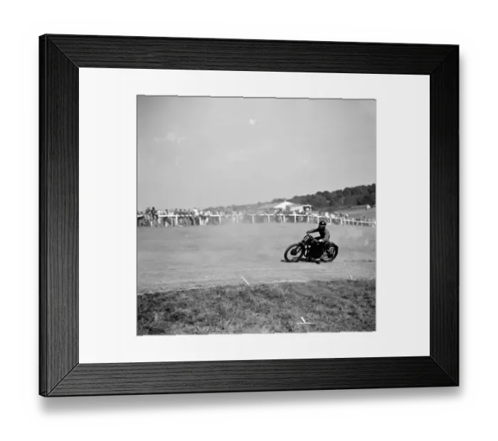 Framed Print : Motorcycle racing at Brands Hatch, Kent. A motorbike takes a corner Framed Print : Motorcycle racing at Brands Hatch, Kent. A motorbike takes a corner
