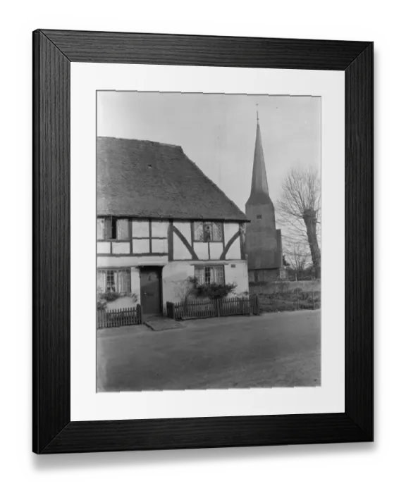 Framed Print : Old timber cottage and a church in Cowden, Kent. 1937