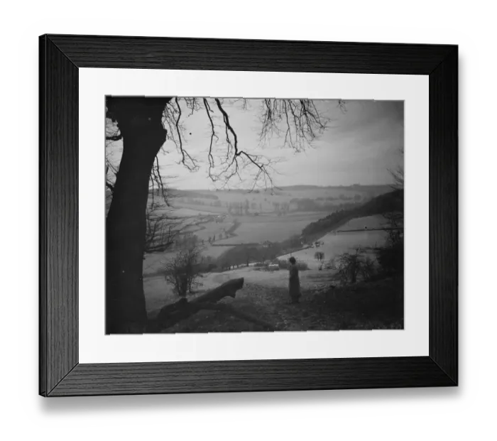 Framed Print : A women stands looking out at Preston hill farm estate. 3 February 1938