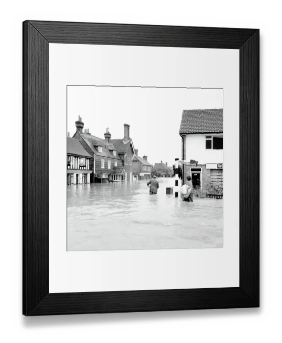 Framed Print : Householders salvaging what belongings they can - at the Southern end of High Street Edenbridge Kent on Sunday evening. Note the wellington boot stuck on the signpost! 11 September 1968