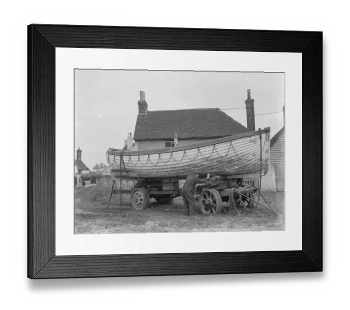 Framed Print : A policeman builds a boat on the village green in Faversham, Kent. 1937 Framed Print : A policeman builds a boat on the village green in Faversham, Kent. 1937