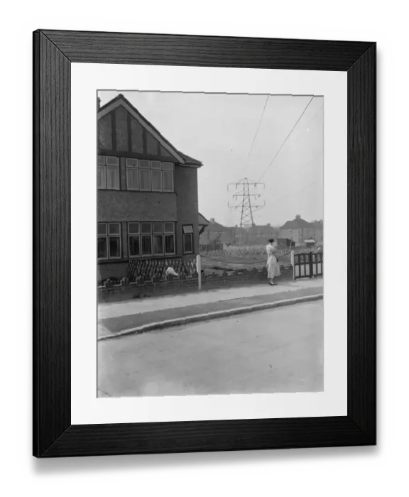 Framed Print : Electricity pylon viewed from the houses. 1937 Framed Print : Electricity pylon viewed from the houses. 1937