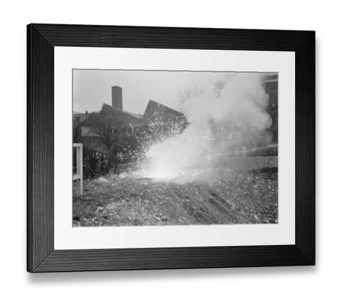 Framed Print : An Air Raid Precautions demonstration in Dartford, Kent. Incendiary bomb explosion Framed Print : An Air Raid Precautions demonstration in Dartford, Kent. Incendiary bomb explosion