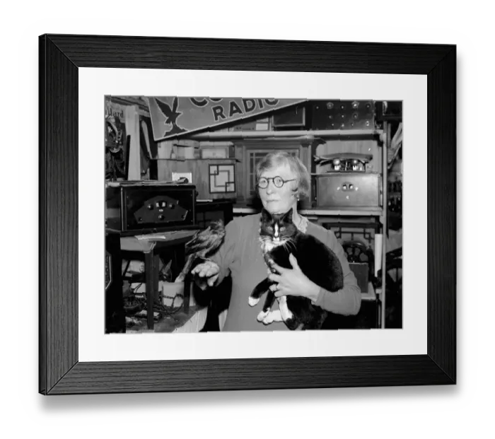 Framed Print : A woman holding a tame jack daw and cat in Footscray, Kent. 1937 Framed Print : A woman holding a tame jack daw and cat in Footscray, Kent. 1937