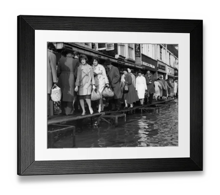 Framed Print : This is how Maidstone coped with the floods in the Main Street, to enable housewives