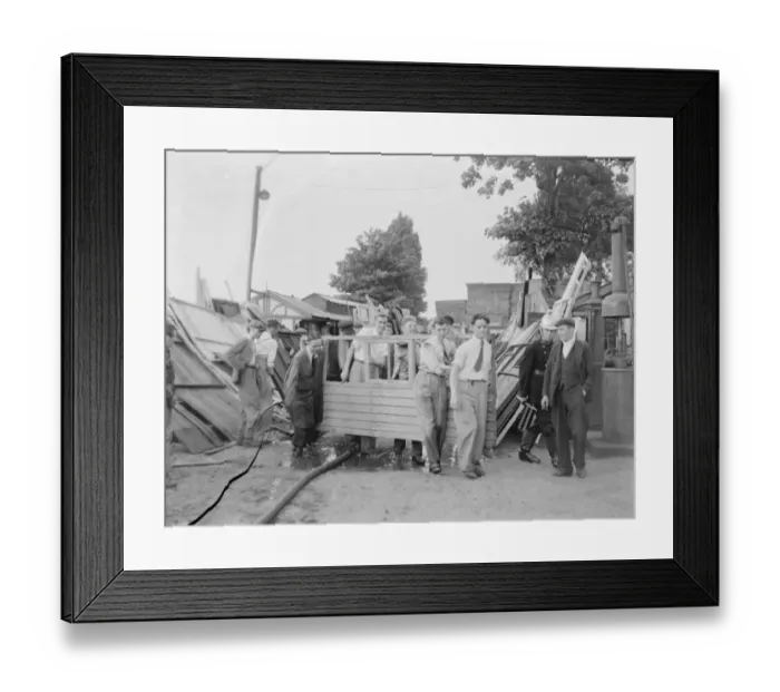 Framed Print : Locals help with the clear up following the timber yard fire in Bexleyheath, Kent