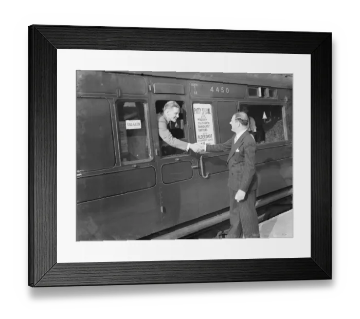 Framed Print : Mr David Behar shakes the hand of a passengers on the train for the Dartford Framed Print : Mr David Behar shakes the hand of a passengers on the train for the Dartford
