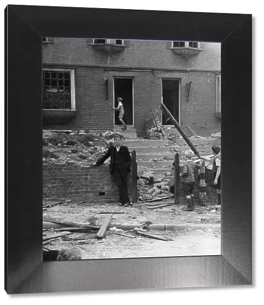 Children inspecting the damage after a bomb fell in Gravesend, Kent during WWII