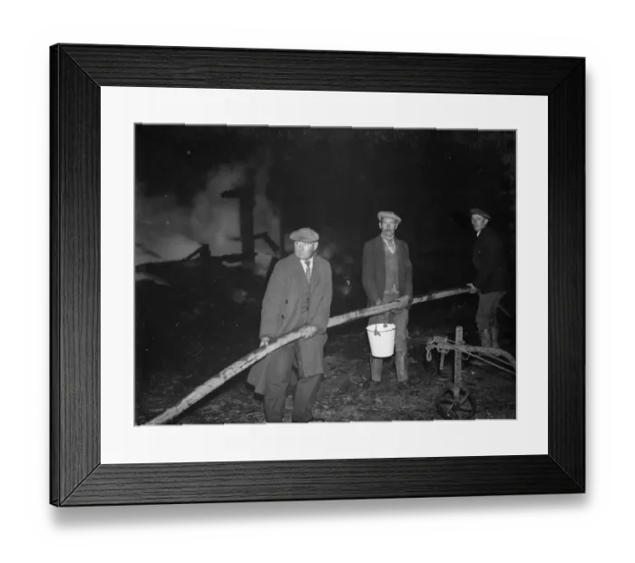 Framed Print : A fire at Chaplins Farm, Hockenden. Farm workers hold the hoses