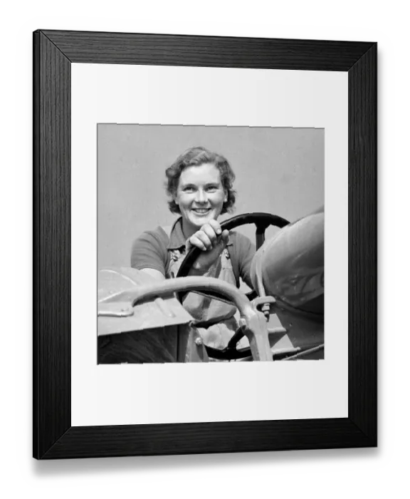 Framed Print : Land Girl driving a tractor during WW2 - a girl now in training for the Womens Framed Print : Land Girl driving a tractor during WW2 - a girl now in training for the Womens