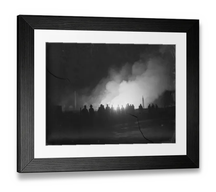 Framed Print : Flames and smoke coming from a fire at the tannery in Dartford, Kent. The silhouetted