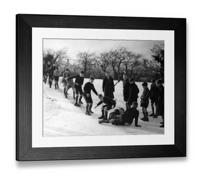 Framed Print : Orpington boys have a fine slide. These boys at Orpington, Kent, made a fine slide Framed Print : Orpington boys have a fine slide. These boys at Orpington, Kent, made a fine slide
