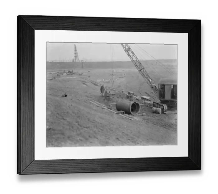 Framed Print : Workmen using a crane for the construction of the Dartford Tunnel. Work begins Framed Print : Workmen using a crane for the construction of the Dartford Tunnel. Work begins