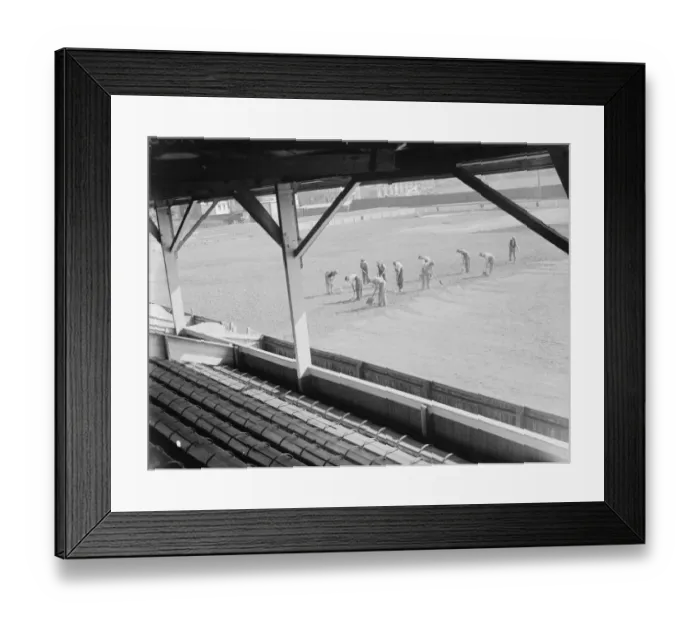 Framed Print : Seen from the spectator stands, workers on the pitch at the Northfleet football ground Framed Print : Seen from the spectator stands, workers on the pitch at the Northfleet football ground
