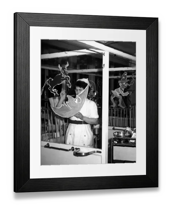Framed Print : Getting ready for the hospital revels - Nurse Kathleen Burrows is seen is this picture
