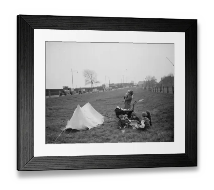 Framed Print : Children have a picnic on a bit of grass next to the road. 1938