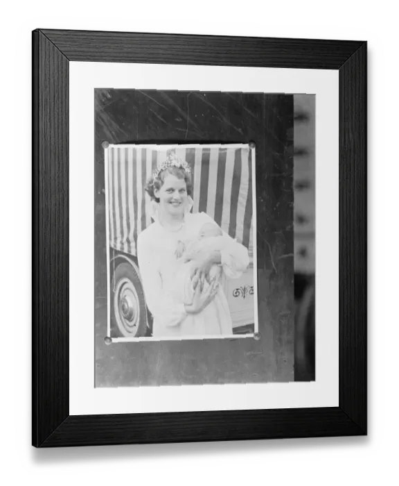 Framed Print : A pinned up photo of the Dartford Carnival Queen holding a baby. 1937 Framed Print : A pinned up photo of the Dartford Carnival Queen holding a baby. 1937