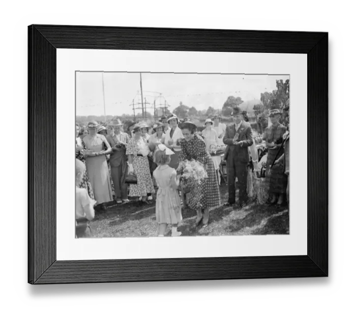 Framed Print : Mrs Bossom wife of Mr Alfred Bossom MP is presented with a bouquet after the official Framed Print : Mrs Bossom wife of Mr Alfred Bossom MP is presented with a bouquet after the official
