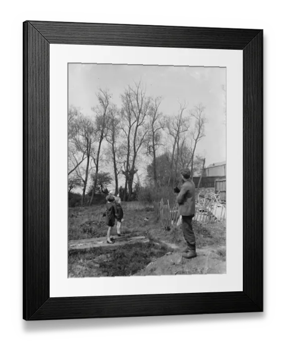 Framed Print : Charles points to the tree from where he rescued the black cat that he is holding Framed Print : Charles points to the tree from where he rescued the black cat that he is holding