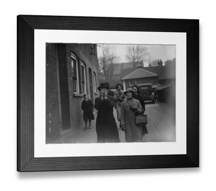 Framed Print : The Vicar of Greenhithe hides his face as he leaves court having been accused of Framed Print : The Vicar of Greenhithe hides his face as he leaves court having been accused of