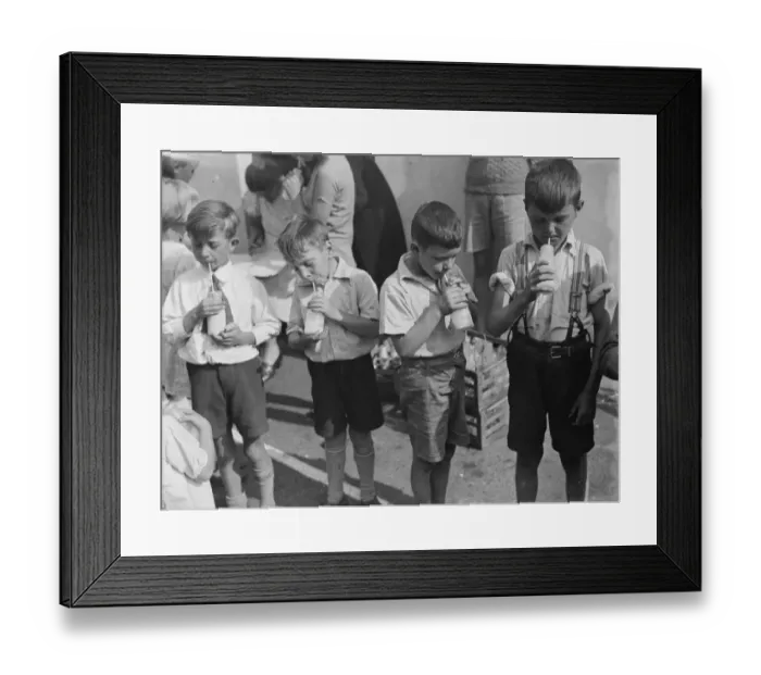 Framed Print : Free milk for children on holiday in Crayford, Kent. Boys stand in a row sipping