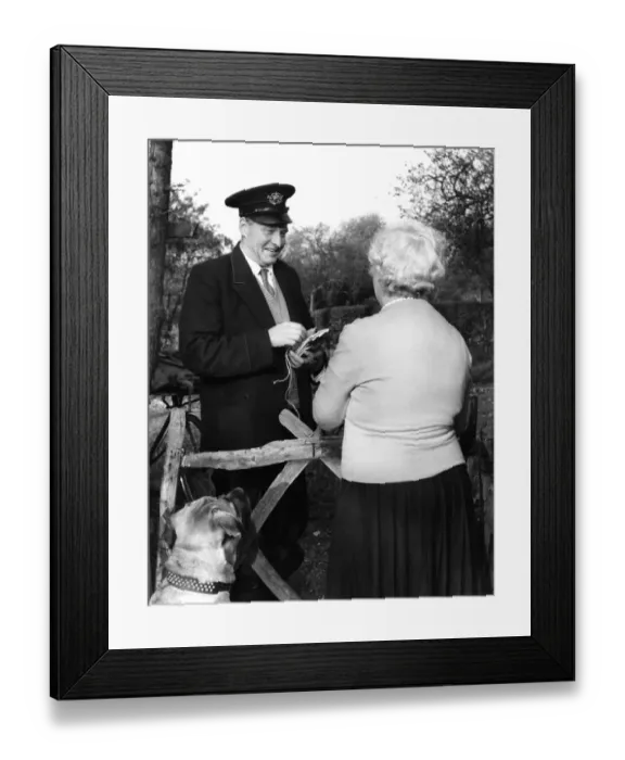 Framed Print : Postman Frederick Smith is photographed making his last delivery on his final day