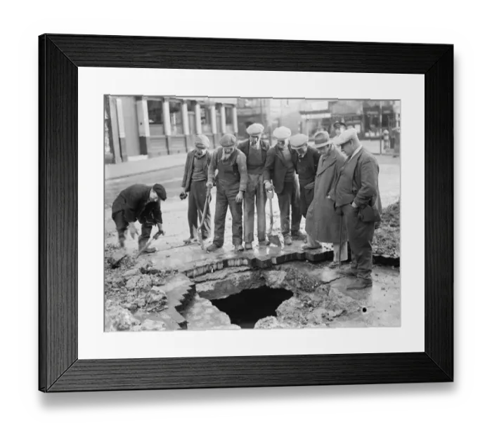 Framed Print : Men stand around a mains water burst in Lee. 1936