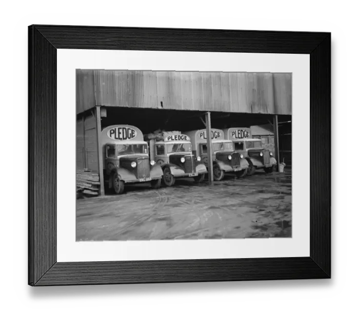 Framed Print : Bedford trucks belonging to Pledge & Son Ltd, the milling company, in a garage