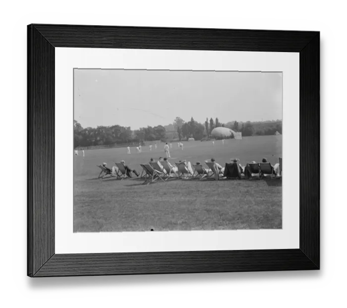 Framed Print : Cricket in Eltham, Kent. A barrage balloon can be seen in the background Framed Print : Cricket in Eltham, Kent. A barrage balloon can be seen in the background