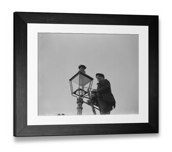 Framed Print : An elderly man lighting an oil street lamp in Hokenden, Kent. 1939 Framed Print : An elderly man lighting an oil street lamp in Hokenden, Kent. 1939