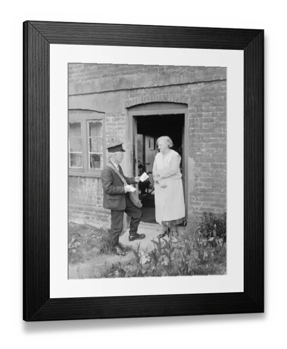 Framed Print : Postman delivering letters to the front door. 1935 Framed Print : Postman delivering letters to the front door. 1935