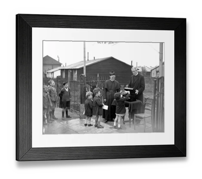 Framed Print : Vicars beg in street at St Bannabus, Eltham, Kent. 1934