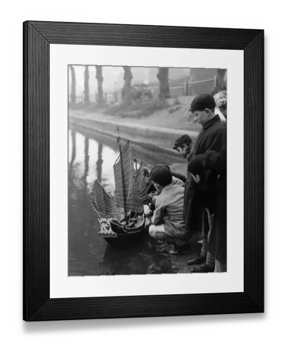Framed Print : Group of boys play with a model ship in Chislehurst Kent Framed Print : Group of boys play with a model ship in Chislehurst Kent